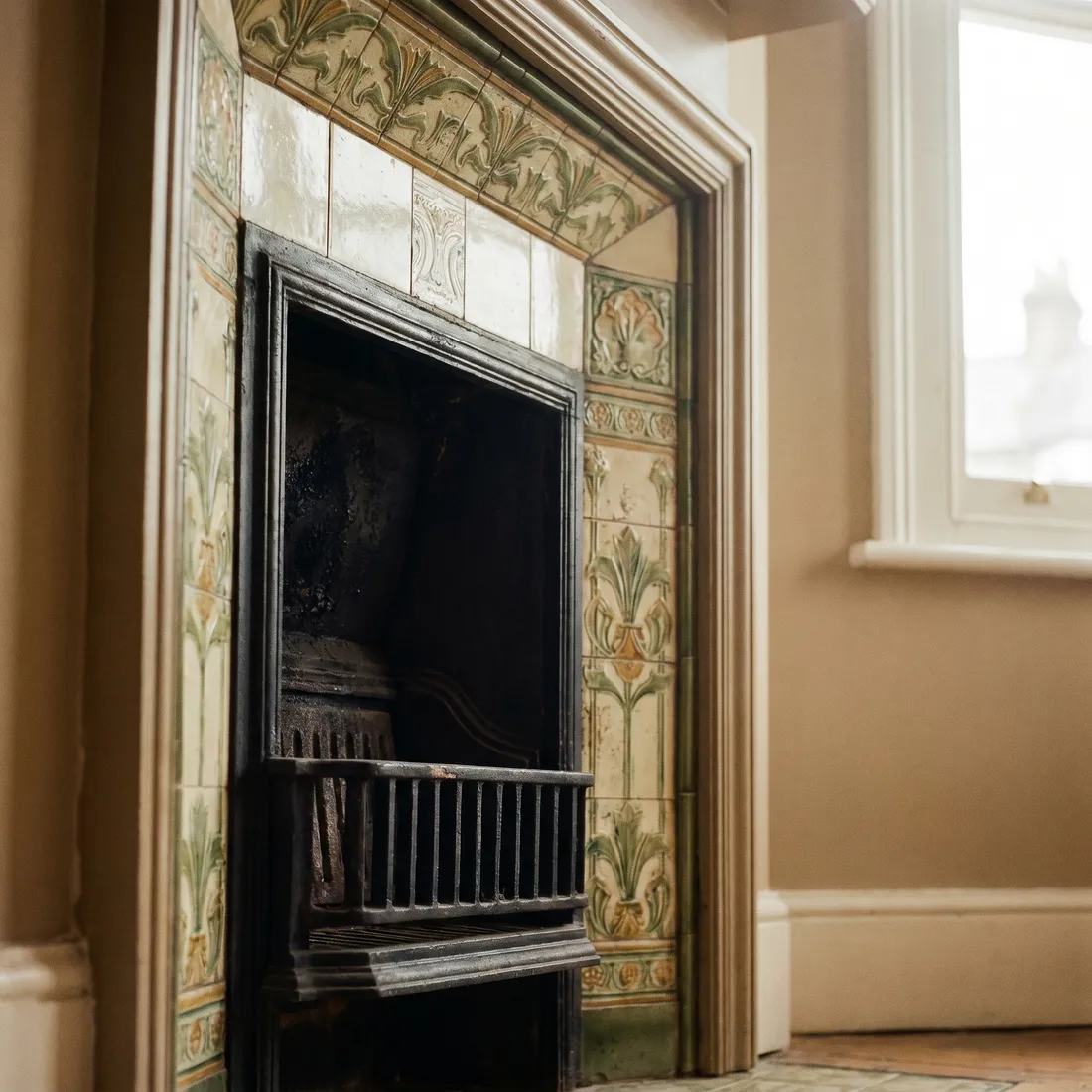 Cast-iron fireplace with a tiled surround